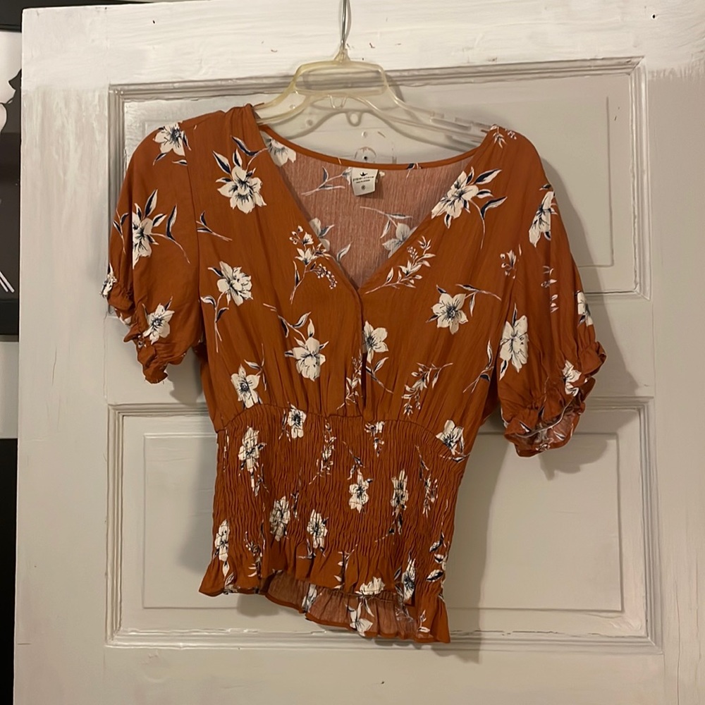 Orange floral blouse